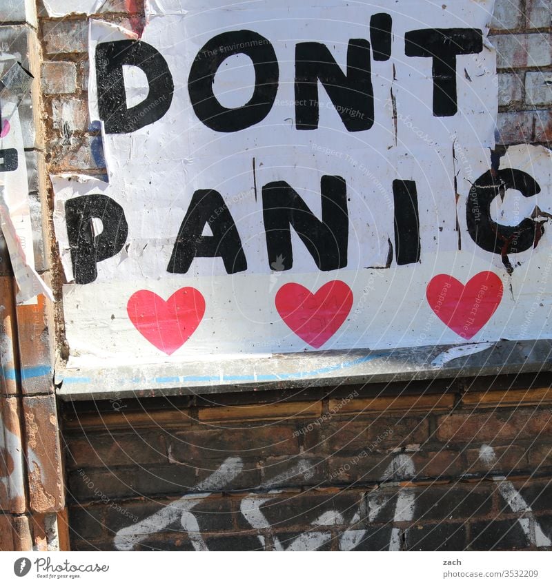 Facade with the inscription Don't Panic Wall (barrier) Wall (building) Stone Brick Structures and shapes Red Old Graffiti Art Decline Stencil Broken Transience