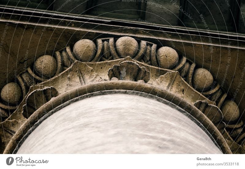 part of the decor of an old antique column abstract ancient architecture backdrop background ball bottom view brown building city close close up color concrete