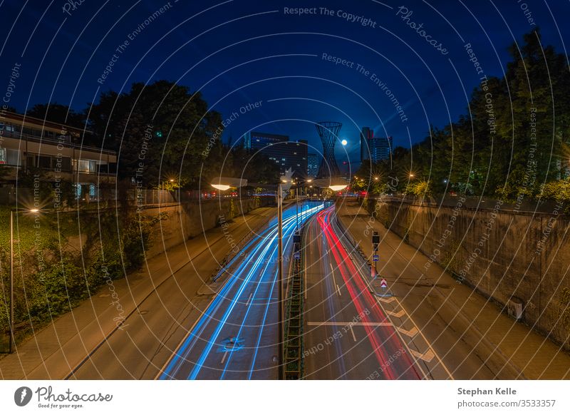 Night drive with light trails of cars in the bavarian cpaital Munich by low light. night abstract traffic city munich urban minga monaco muenchen germany travel