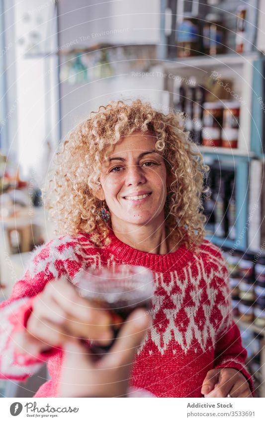 Bartender with wine in glass bartender shop tap local seller beverage drink alcohol retail tradition small business owner authentic pub store service cup goblet