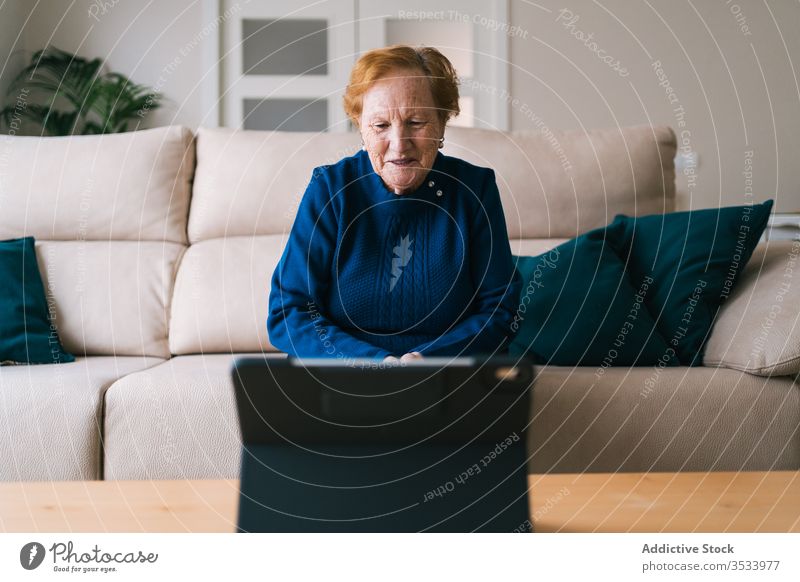 Old woman communicating with daughter on video chat on laptop video call home senior meeting using online remote distance coronavirus isolation quarantine