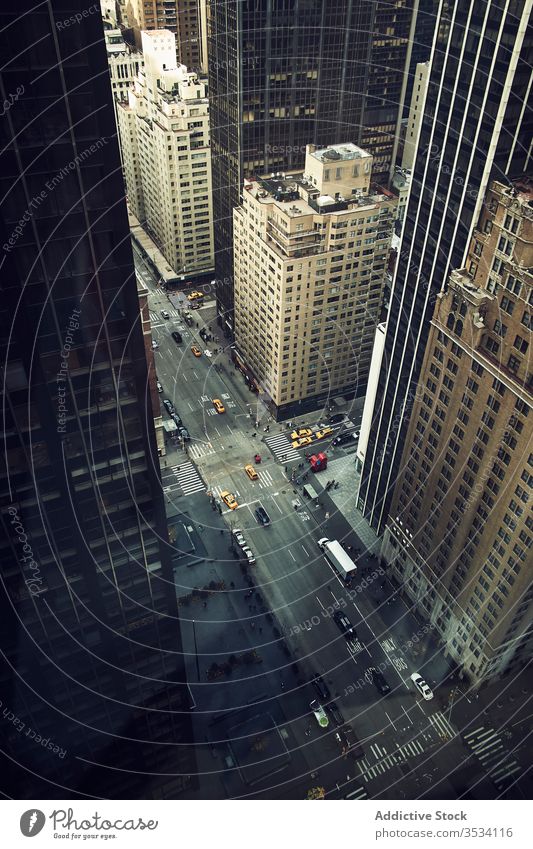 City avenue with tall skyscrapers and vehicles street traffic center new york road megapolis business tower urban building construction usa america city