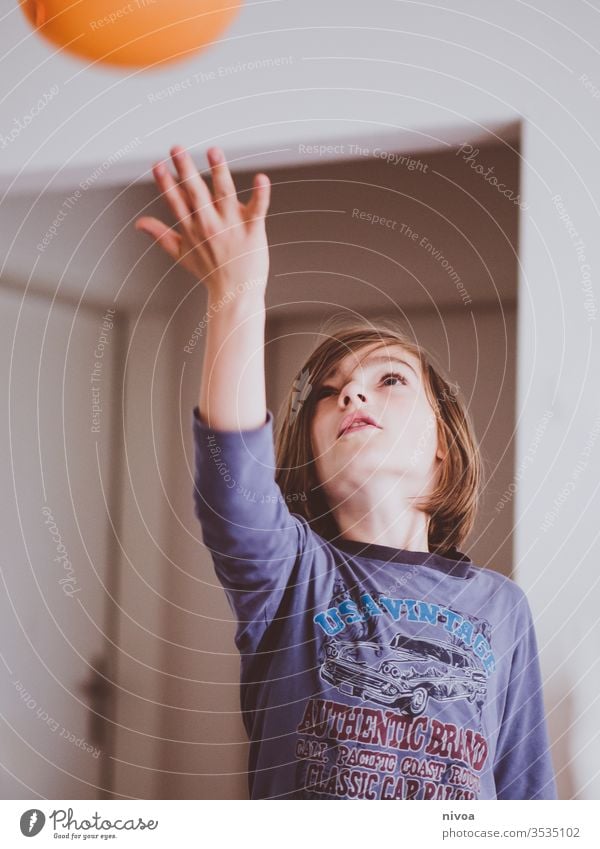 boy playing indoors Boy (child) Child Pyjama Colour photo Playing Cute Infancy Face Human being Joy Day Interior shot Happy Lifestyle Home Caucasian Ball