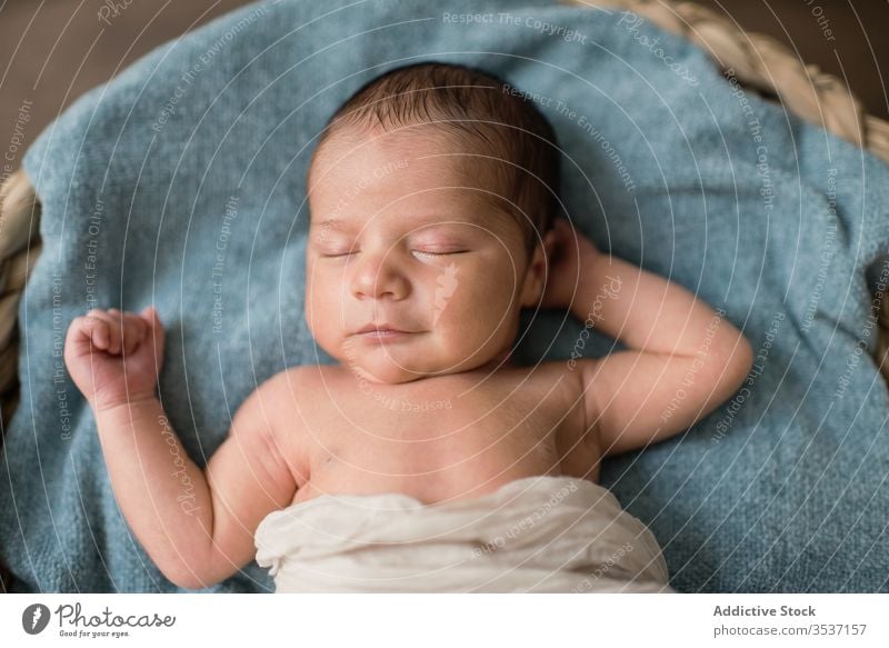 Infant sleeping on blanket in basket baby home wicker peaceful newborn lying soft floor innocent infant child kid dream adorable serene little tranquil