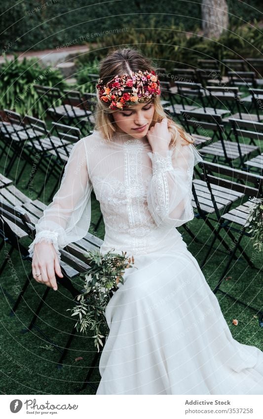 Elegant bride resting on guest seats woman ceremony wedding garden sit chair eyes closed elegant female blossom bloom calm idyllic celebrate event dress flower