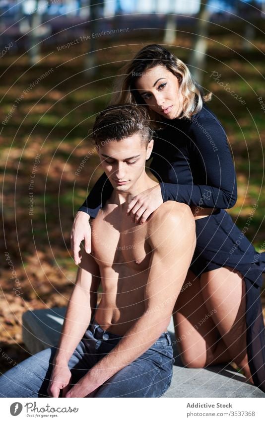 Calm couple having rest in park sensual relax lean together woman tender peaceful gentle calm attractive romantic blouse lifestyle outdoors young relationship