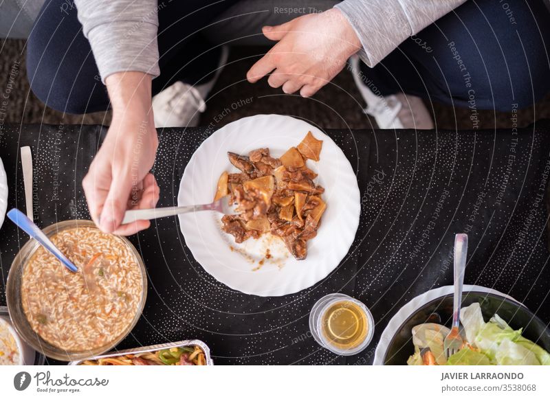 Eating chinese delivery food at home .Top view.Relax time.Enjoy the weekend.Enjoy the isolation. away background chinese food comfortable container couch