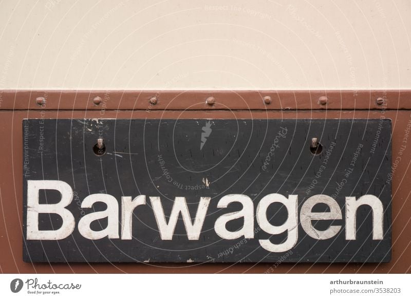 Shield of bar car of an old railway Inscription Beige Brown sign Black Blackboard Drinking rations weigh wagon Train Train compartment Railroad Railroad car