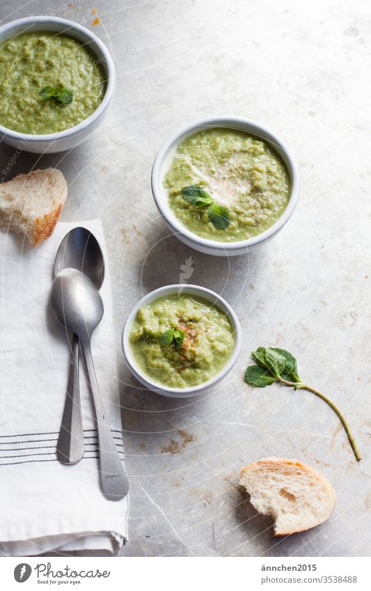 Pea soup with topping and bread Tin Rust Colour photo Food Close-up Deserted Detail Day Subdued colour Metal green Bread Eating Lunch Dish Interior shot Dinner