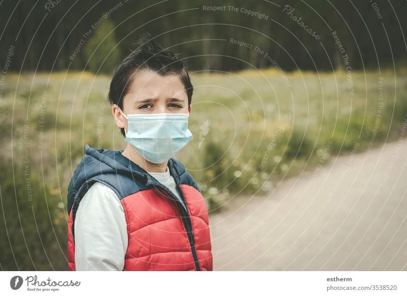 Coronavirus,sad kid wearing medical mask coronavirus child epidemic pandemic thoughtful quarantine covid-19 symptom medicine health death protect childhood