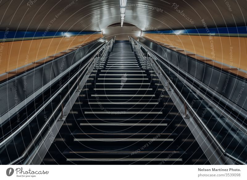 Stairs from metro station leading up to street, empty by covid19. train lines stairs shapes alone empty space electric stairs COVID19