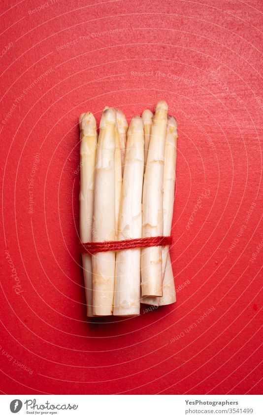 White asparagus on a red table, top view. Fresh vegetables above view agriculture bavarian bunch bundle cuisine cut out diet dutch farmers market food fresh