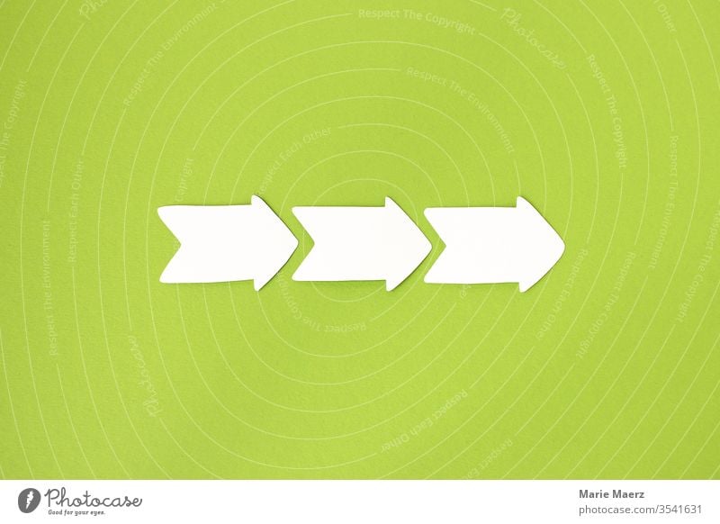 Continue | Three paper arrows point to the right on a light green background Success Sign Positive Lanes & trails Target Economy Future Neutral Background