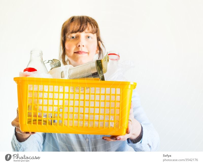 Caucasian woman with trash ready for recycling recycle environment plastic environmental sustainable sort disposal female bin ecology waste holding garbage