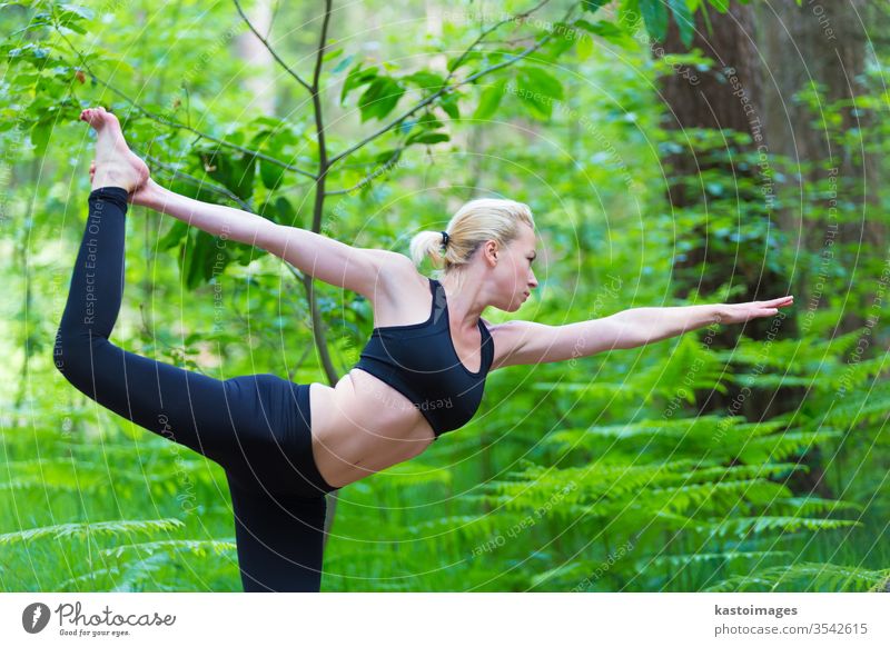 Lady practicing yoga in the nature. outdoor park woman harmony balance pose relaxation female healthy exercise girl lifestyle young person meditation body