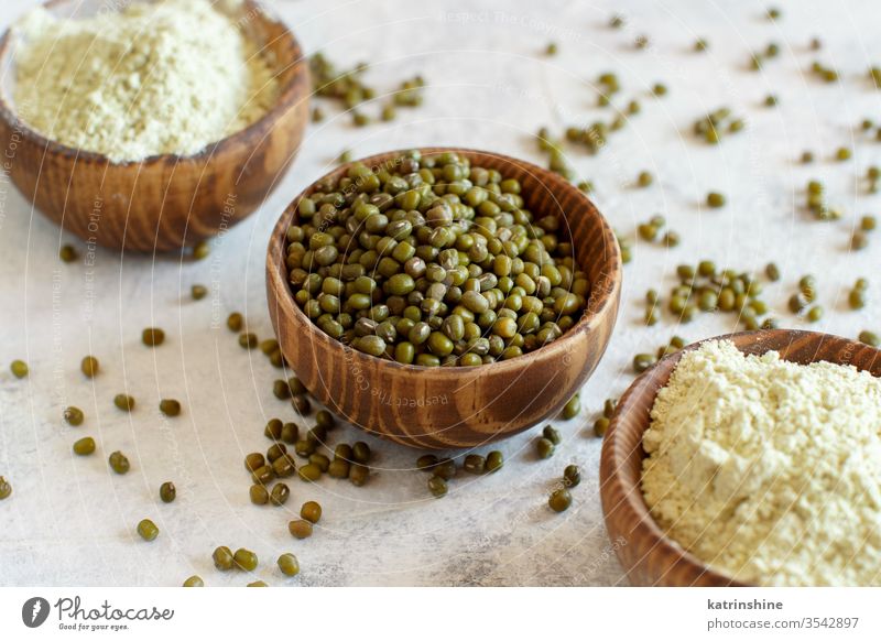 Mung beans flour and grain in bowls raw dry mung alternative flour food ingredient gluten free concept close up rustic cuisine healthy heap pile diet edible