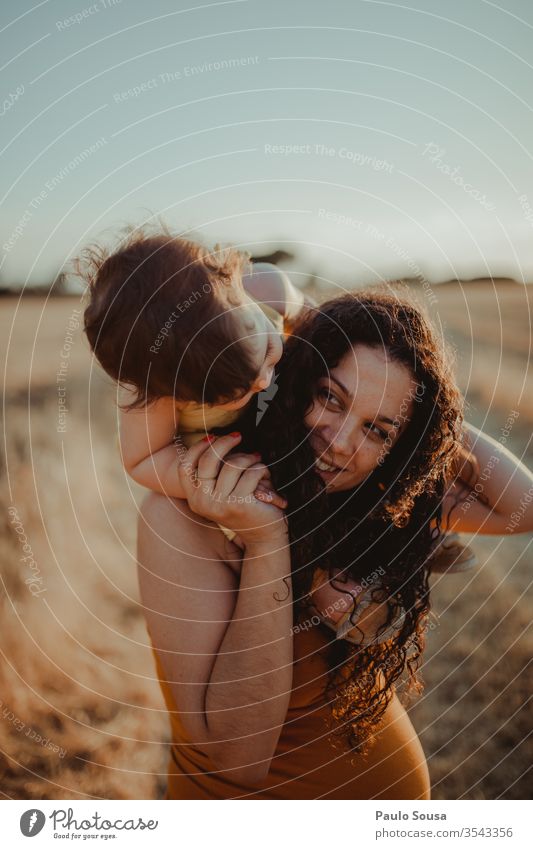 Mother carrying Daughter on her shoulders motherhood Child Family & Relations Together togetherness Shoulder Carrying people Woman Cute Happiness Smiling