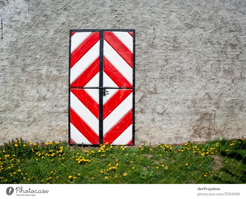 Colourful door in Brandenburg farmstead Central perspective Copy Space middle Copy Space top Copy Space right Copy Space bottom Deep depth of field Light Day