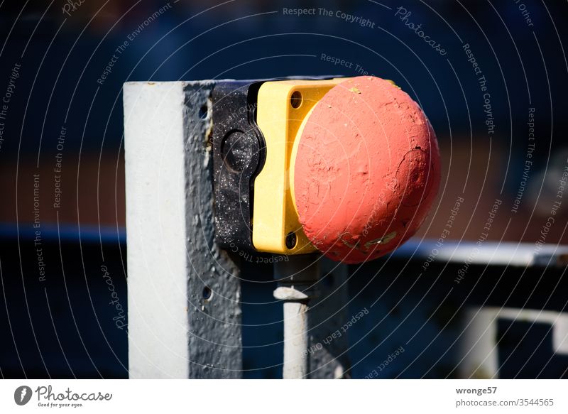 Emergency stop button on a steel construction emergency stop Safety switch Safety button Angle iron Industry Colour photo variegated Red Yellow Multicoloured