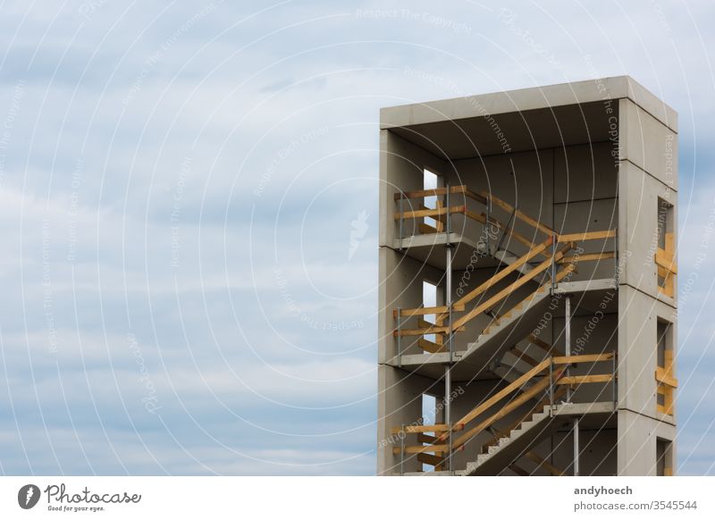 the stairwell and the sky of a construction site apartment architecture build building built cement city cloud scape concrete contrast copy design development