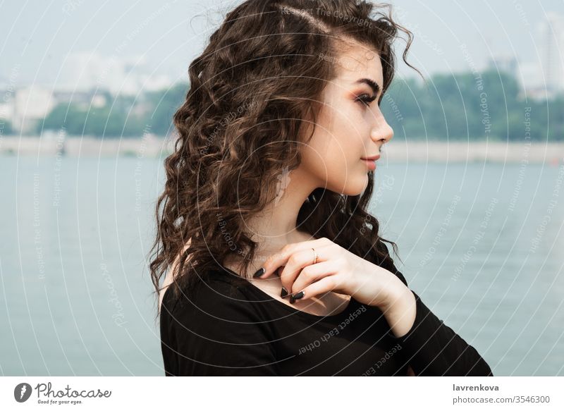 Young female on a beach, selective focus alone attractive girl lifestyle make up ocean outdoor person portrait romantic sand sea sky summer view woman young