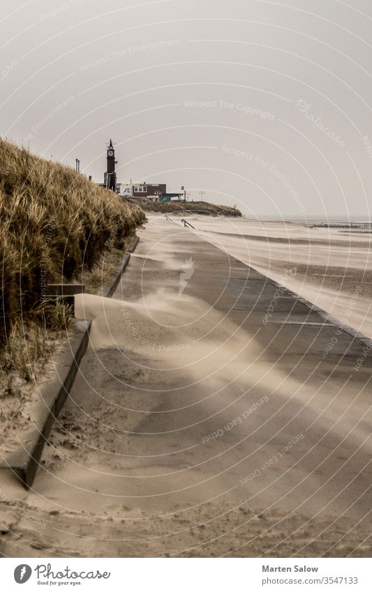 wind blows across the beach sand island storm stormy nature countryside sea destination windy cloud path view relax nobody outdoors sky dune way scenic