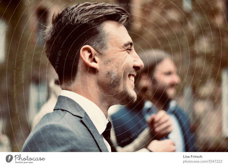 man - happy - laugh - enjoy Man 18 - 30 years brunette Suit suit-wearer Facial hair Laugh lines pretty To enjoy Joy Guest Wedding muck about in common Gray