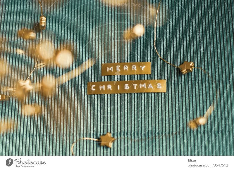 Merry Christmas. Christmas in gold and blue. English merry christmas Decoration Blue golden Card Adorned Corrugated board Design Text authored