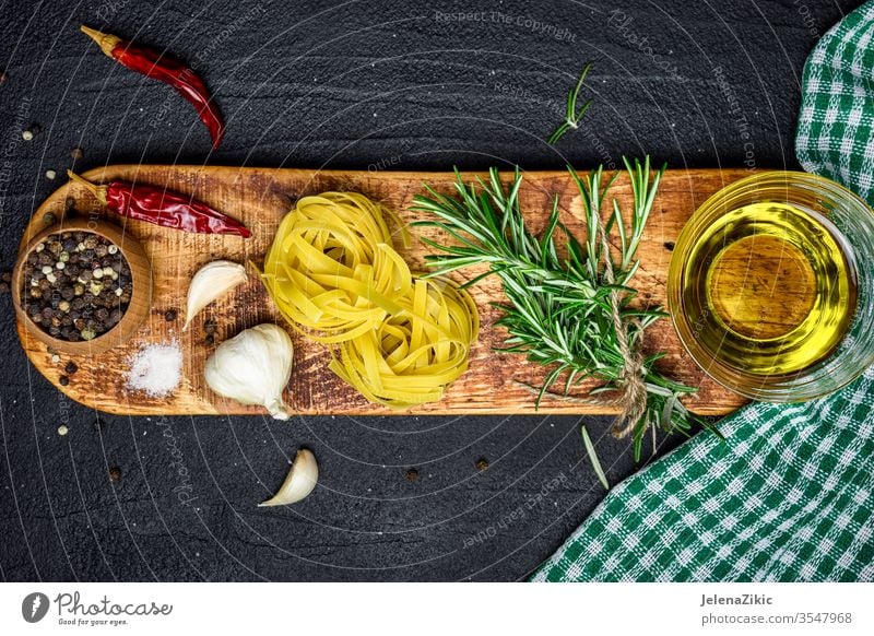 Italian cooking background rosemary ingredient fresh herb raw organic food green cuisine plant nature seasoning healthy garlic table herbal italian culinary