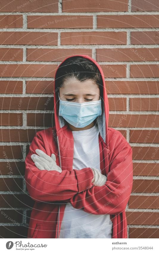 Coronavirus,sad kid wearing medical mask coronavirus child epidemic pandemic thoughtful quarantine covid-19 symptom medicine health death protect childhood