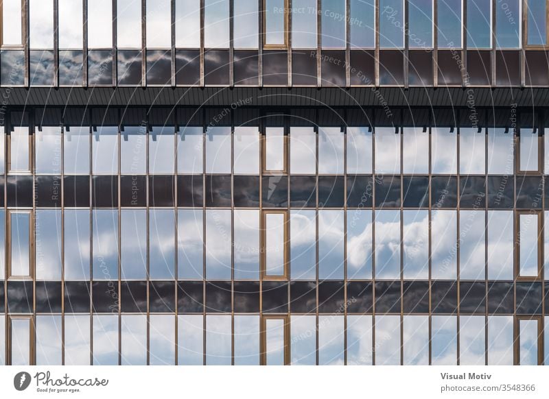 Glass facade of an office building windows architecture architectural architectonic urban metropolitan constructed edifice structure geometric geometrical