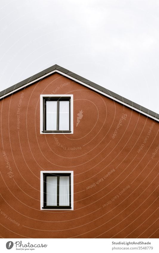 Facade and windows of an orange house building roof Europe European Stockholm Sweden Swedish Scandinavia Scandinavian facade urban city town red white gray grey