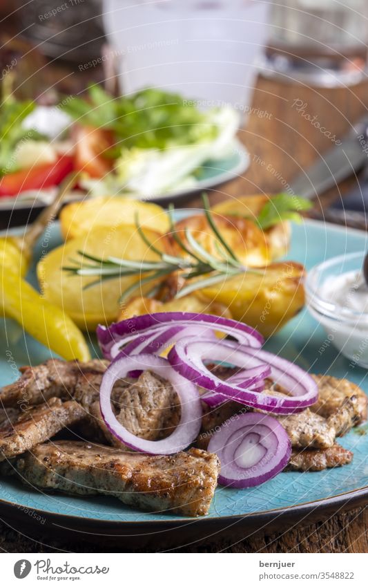 Greek gyros with salad and ouzo Lettuce cake Roasted Rustic olive roasted tzatziki Kebab Set table Gyro Meat traditionally tribunal Cucumber Eating Bread Mixed