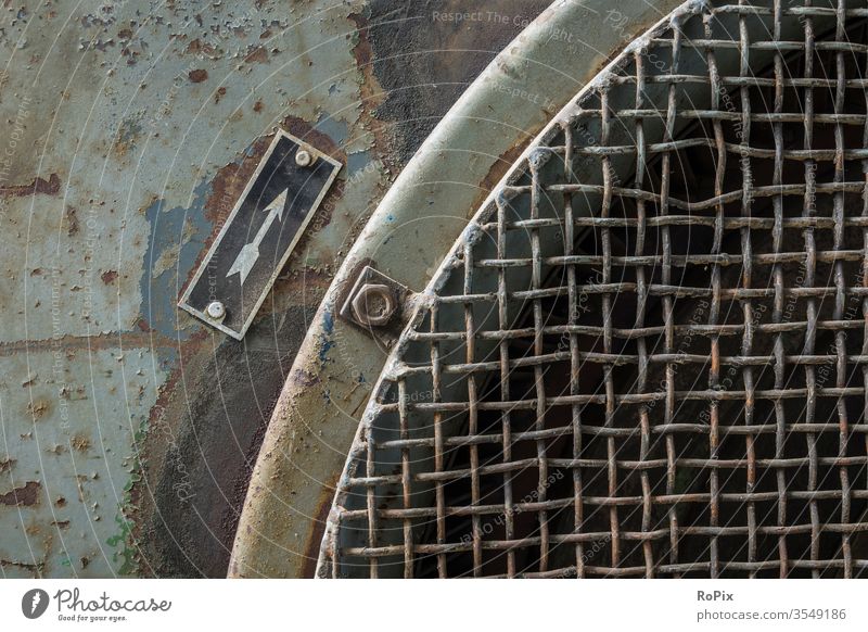 Detail of an industrial blower. Grating Grid plate Covers (Construction) Ventilation slots Saw blade Machinery Protective grid Job security Industry technique