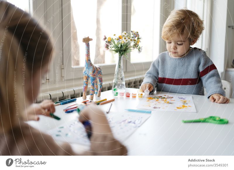 Preschool brother and sister painting together at home children draw creative play preschool studio living room gouache colorful blond little drawing kid light