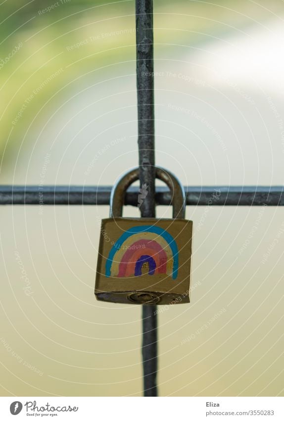 A padlock as a love lock with a colourful rainbow on a bridge Love padlock Padlock Lock Rainbow diversity variety LGBT LGBTQ pride love for all equal rights