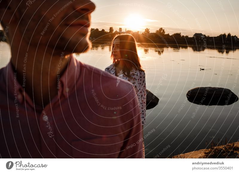 Closeup of happy loving couple spending leisure time together at beach. couple in love by the water. warm summer day. young romantic people happiness sea