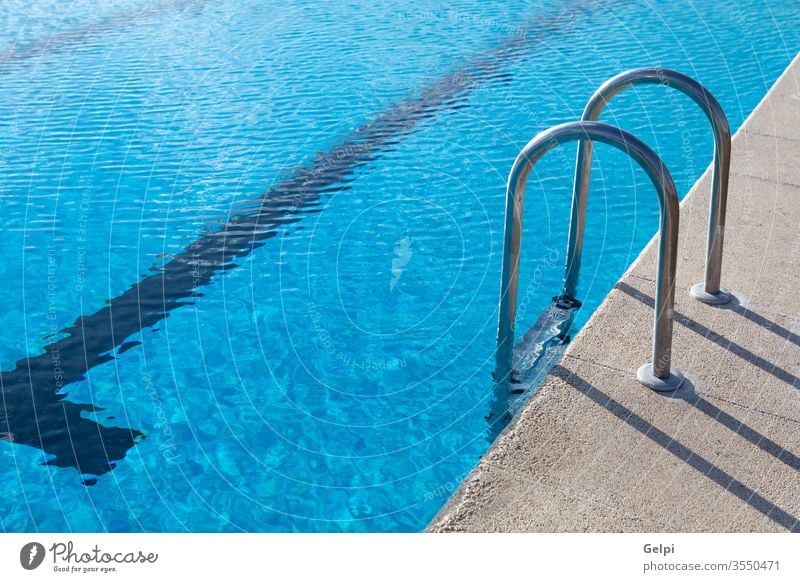 Olympic pool with a blue water lifestyle summer sunny leisure nobody modern luxury tranquil swim health resort sport hotel healthy vacation spa wet reflection