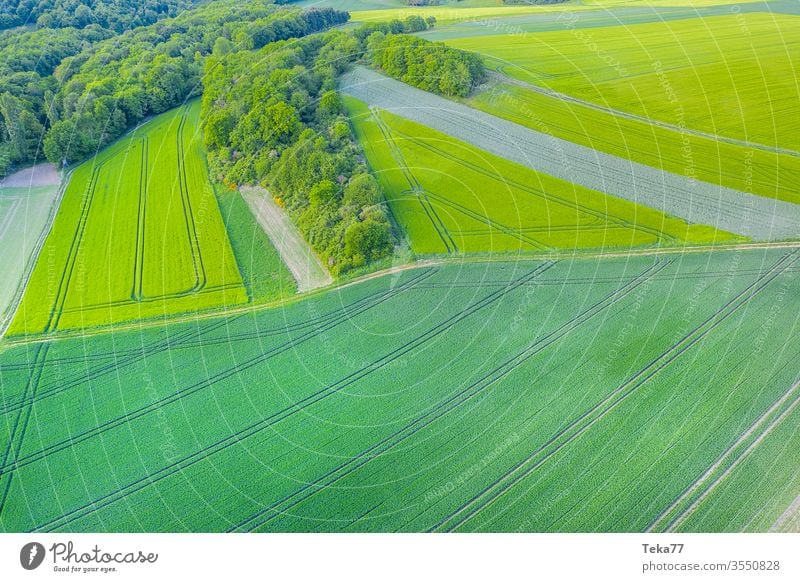 meadows and fields from above background agricultural agricultural way tractor tractor path field background meadow background air aerial view aerial photo