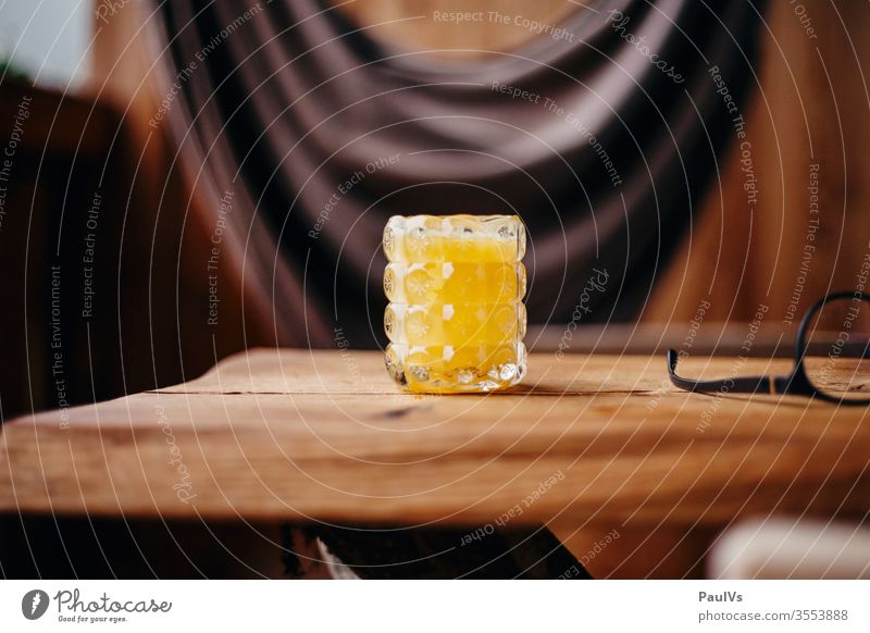 Glass with orange juice on wooden table Orange juice Breakfast Juice glass vitamins Vitamin C Nutrition salubriously vacation fruit Food smoothie Table Beverage