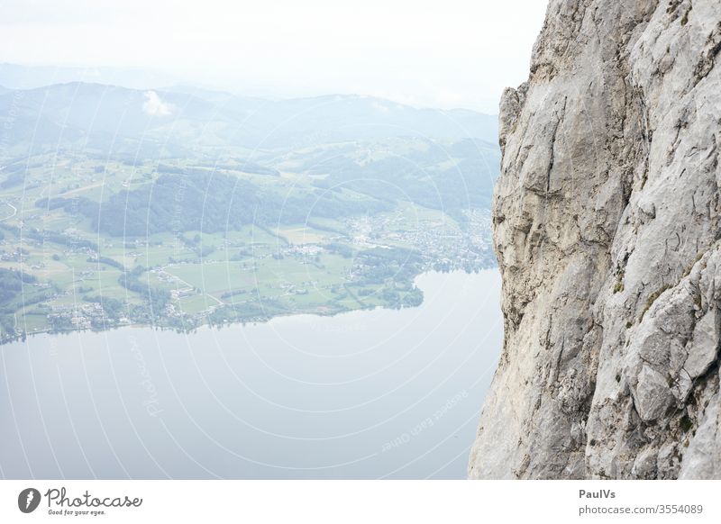 Rock face next to lake in Salzkammergut Austria Traunstein Wall of rock Lake Salzkammergut Lake Traunsee Gmünden Upper Austria Pre-alpes ostalpen Climbing