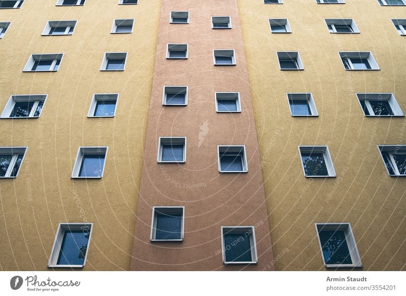 simple orange and yellow facade of a house Facade social housing projects kreuzberg apartment seamless architecture background backlight backlit beautiful