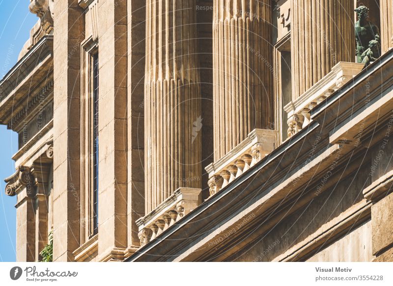 Base of Ionic columns, small balustrade and cornice of the National Art Museum of Catalonia in Barcelona aka MNAC building ornament historic old statue sunny