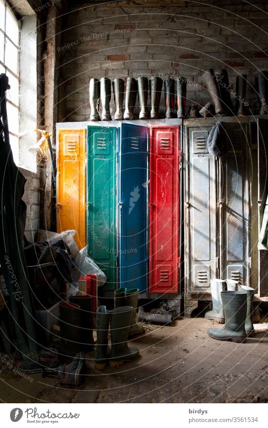 Colourful spinte with work clothes and rubber boots on a farm Work and employment Workwear Spinte safekeeping Rubber boots Changing room Farm Window Arrangement