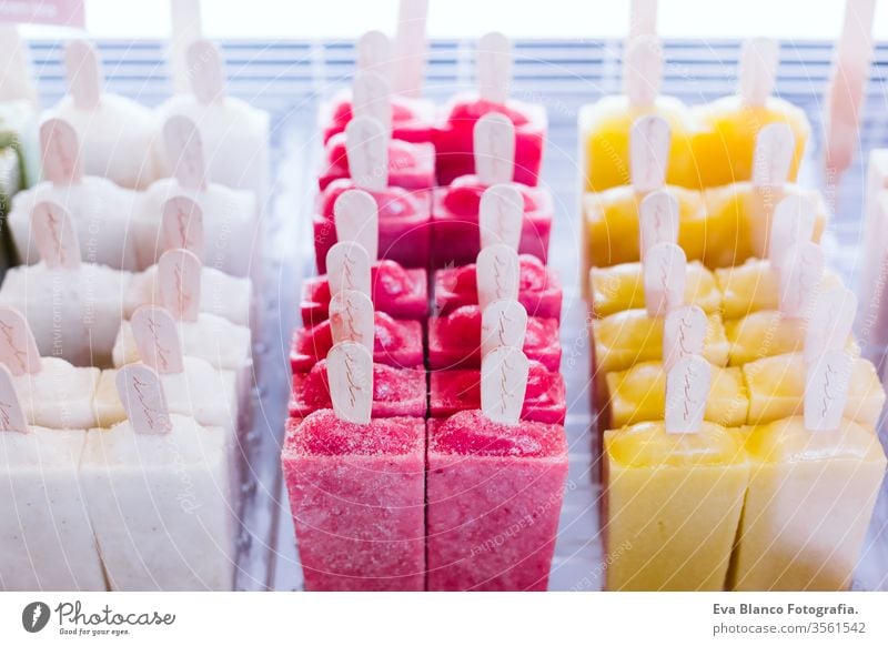 close up view of ice cream fruits in a market. healthy lifestyle summer frozen cold watermelon pineapple kiwi strawberry nobody shop organic grape sale