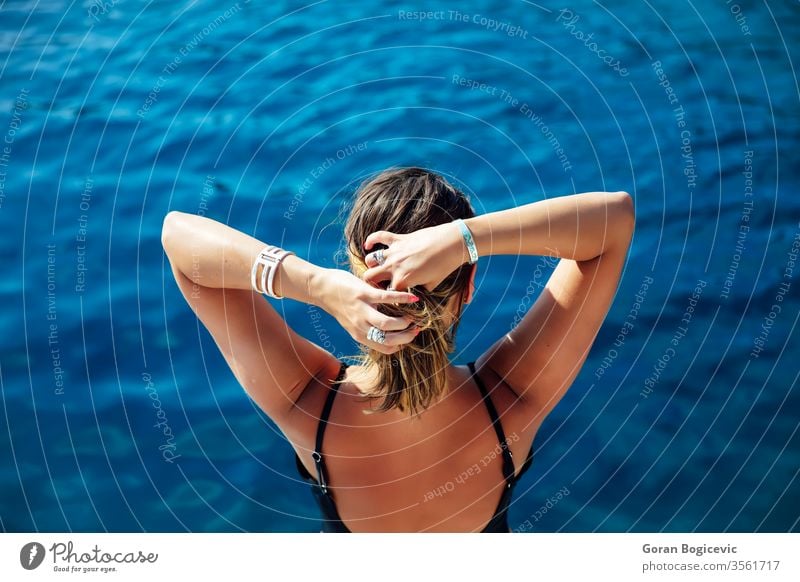 Young woman relaxing on the yacht on sea at sunny day adult alone attractive beautiful blue board boat calm caucasian cruise cruising deck female happy holiday