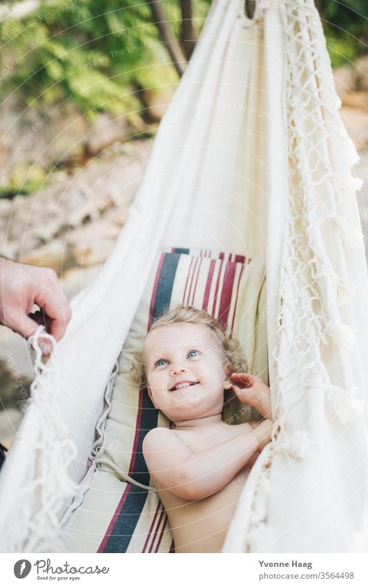 Toddler lies smiling in the hammock Beach Sky Coast Clouds Colour photo Nature Wind Exterior shot Landscape Storm Water Bad weather Storm clouds Climate