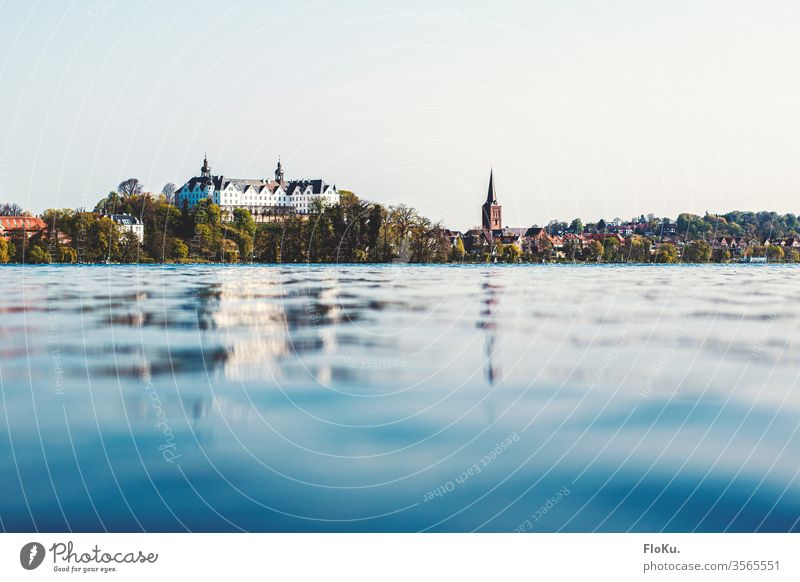 Plön Castle reflected in the large Plön lake plöner castle Lock Manmade structures Tourist Attraction Water Nature reflection Lake Lake Plön large plöner lake