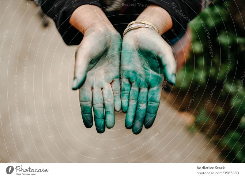 Crop woman showing hands in Holi powder holi festival hindu street colorful city vibrant female vietnam asia demonstrate vivid holiday celebrate event tradition