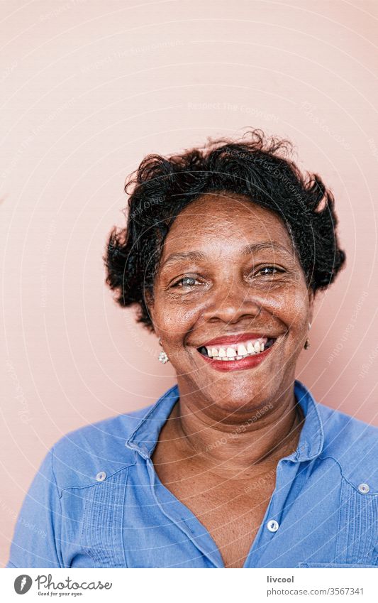 smiling cuban lady, cuba blue face people portrait one people nice pretty pink wall caribbean island cuban woman grandmother street real people lifestyle